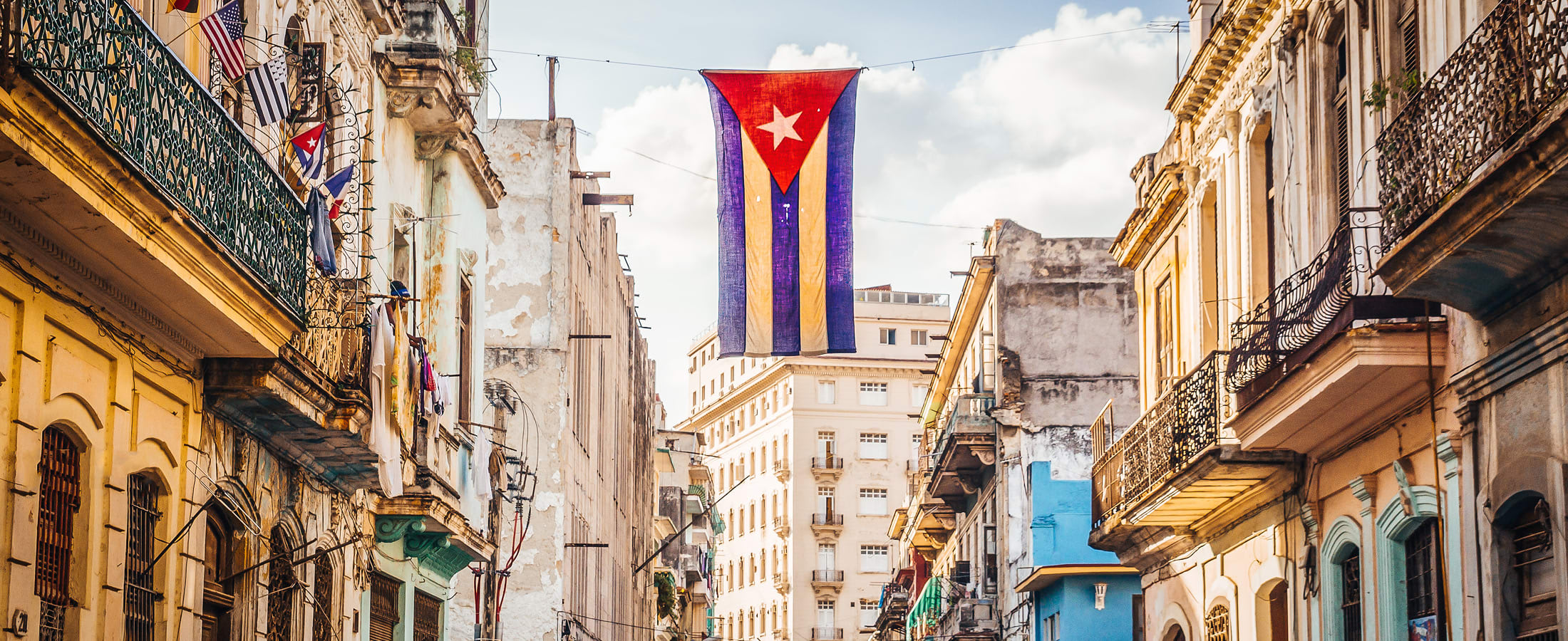 Cuban flag hanging over the streets of Old Havana