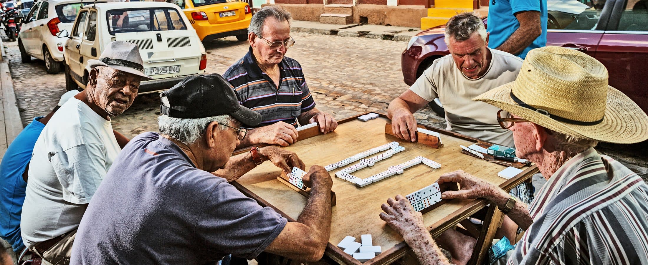 Playing dominoes, Trindad