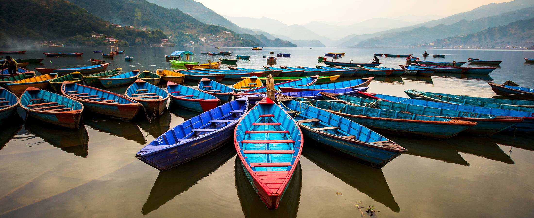 Colorful boats on Phew Lake at twilight, Pokhara