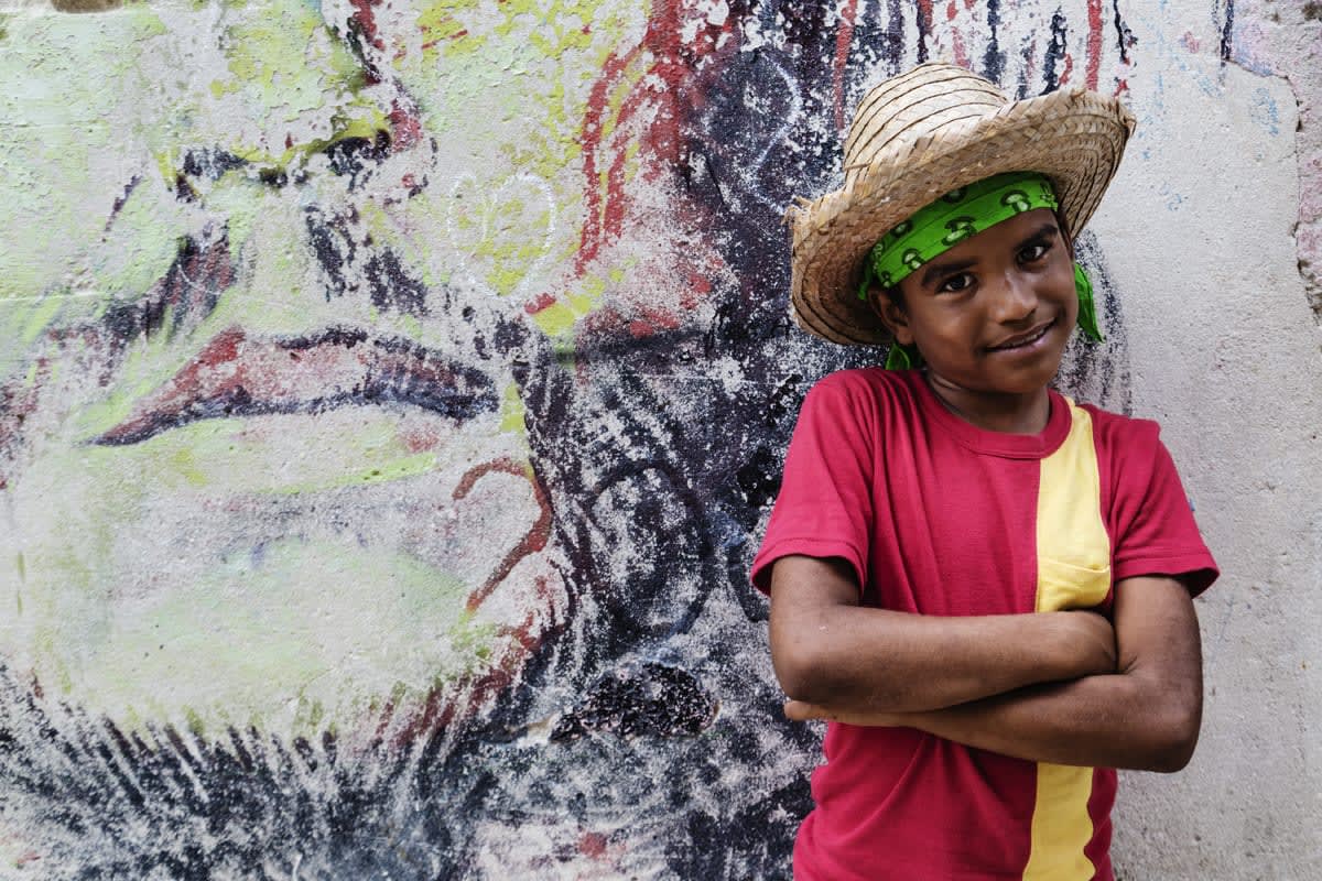 Child in front of mural