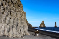 Couple walking along the beach, Reynisfjara 