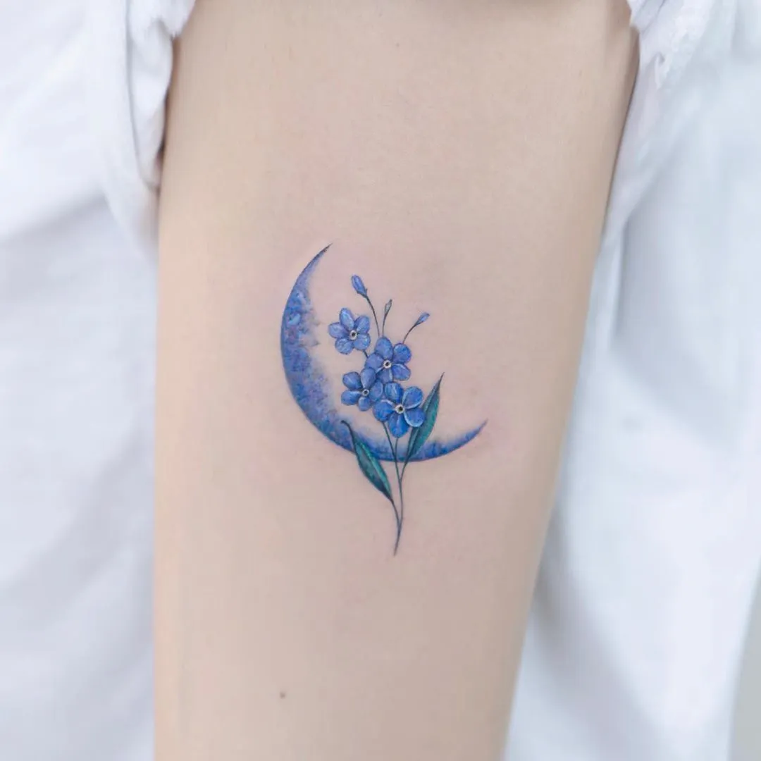 Forgetmenot flower tattoo on the left side of the