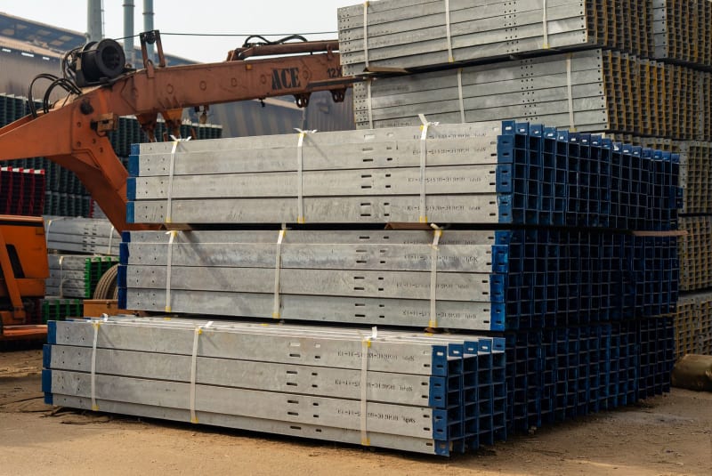 Hot-dip galvanized steel beams staged with crane, Karachi Galvanizing & Engineering