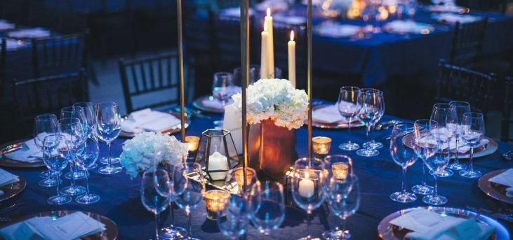 A table set for dinner with glasses and candles