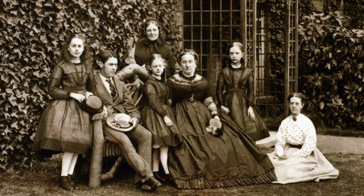 black and white photograph of bishop taits wife and four children outside of the palace