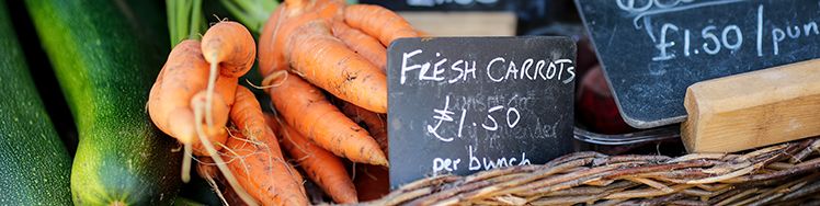 fresh carrots and courgettes for sale on the market barrow