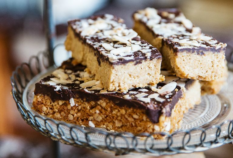 chocolate topped millionaires shortbread stacked on a plate