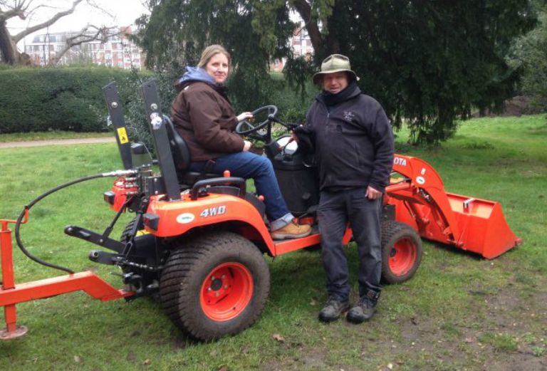 garden-apprentice and supervisor with a tractor