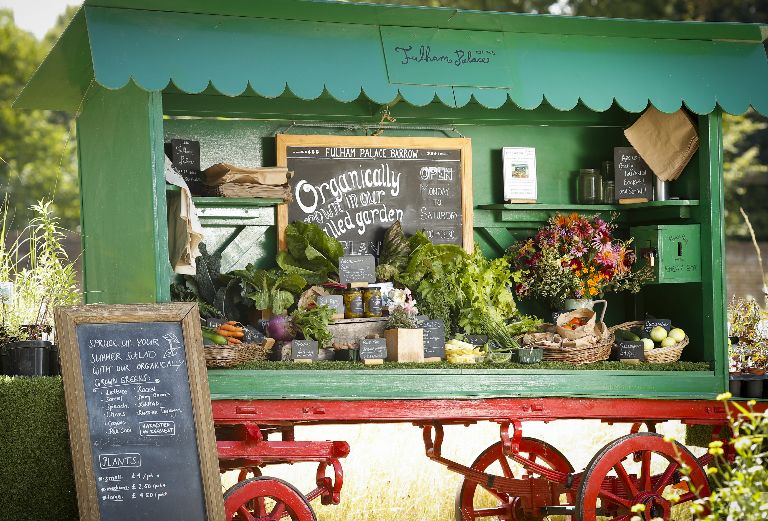 the market barrow full of produce for sale