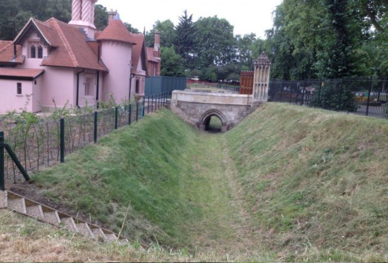 moat-after-grass-cutting-with-bridge-in-background