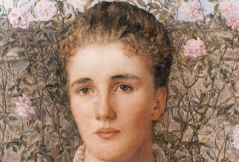 portrait of louise creighton standing in front of pink flowers