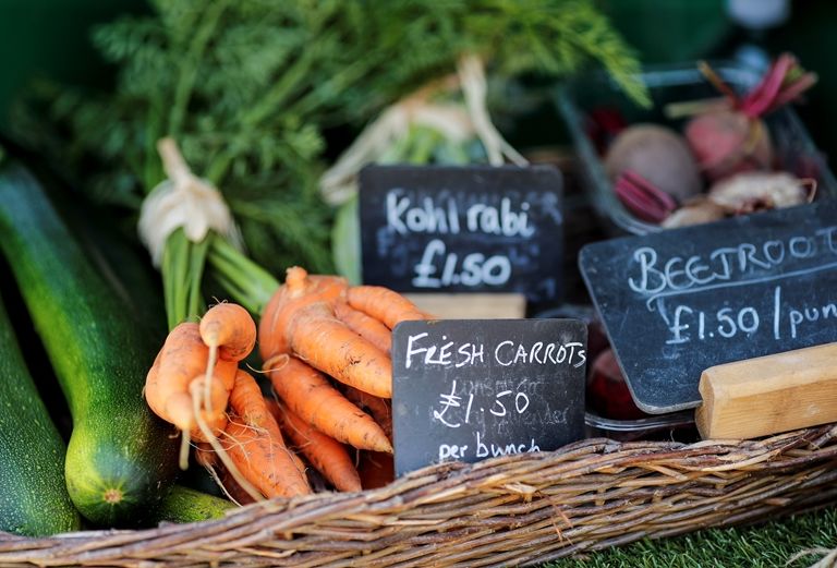 carrots, kohl rabi and beetroot on the market barrow