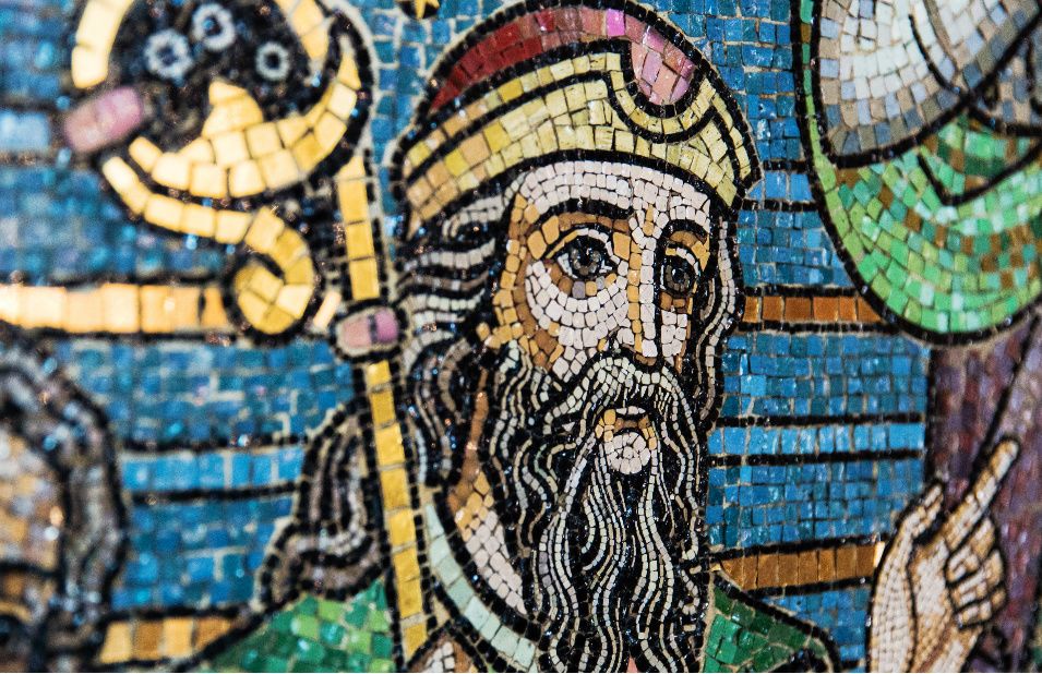 colourful mosaic depicting head of man holding crook and pointing his finger