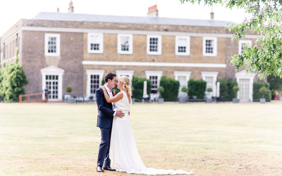 couple stands embracing each other after a wedding