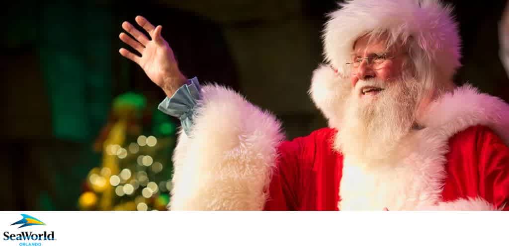Person dressed as Santa Claus with raised arm, in a festive setting. SeaWorld Orlando logo at bottom left.