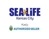 Logo for SEA LIFE Kansas City, depicted with bold blue and purple letters, where the letter 'A' is stylized as a golden starfish. Below is a tagline 'Kansas City' in a smaller font. An additional logo indicates that the seller is an 'AUTHORIZED SELLER' with a green checkmark graphic. The image conveys partnership and ticket availability for SEA LIFE Kansas City at the specified vendor.