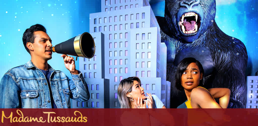 This promotional image features a vibrant and playful scene set against a backdrop of a starry night sky and whimsical city skyline. On the left, a person with short dark hair wearing a denim jacket speaks into a large megaphone. To their right, two individuals with expressions of surprise and intrigue look at something off-camera. The first has long light-colored hair, is crouching, and facing backwards while looking over her shoulder. The second person, looking towards the right, wears a sleeveless yellow top. Behind them looms a large, animated figure of a ferocious gorilla, with its mouth wide open as if roaring. The iconic red and gold logo of Madame Tussauds is prominently displayed at the bottom. Experience the magic and create unforgettable memories with loved ones. And remember, at FunEx.com, we're committed to helping you find the biggest savings and the lowest prices on tickets for your next adventure!