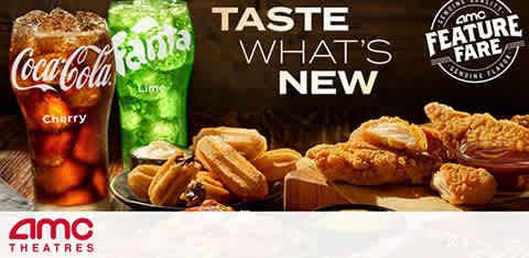 The image showcases AMC Theatres' new menu items. On the left, two soda cups, one labeled Coca-Cola Cherry and the other Fanta Lime, are depicted with effervescent drinks. The center and right of the image feature a variety of cinema snacks such as chicken tenders with sauce, a hot dog, and a pretzel. The text 'TASTE WHAT'S NEW' invites viewers to try the featured fare at AMC locations. The AMC Theatres logo is in the bottom