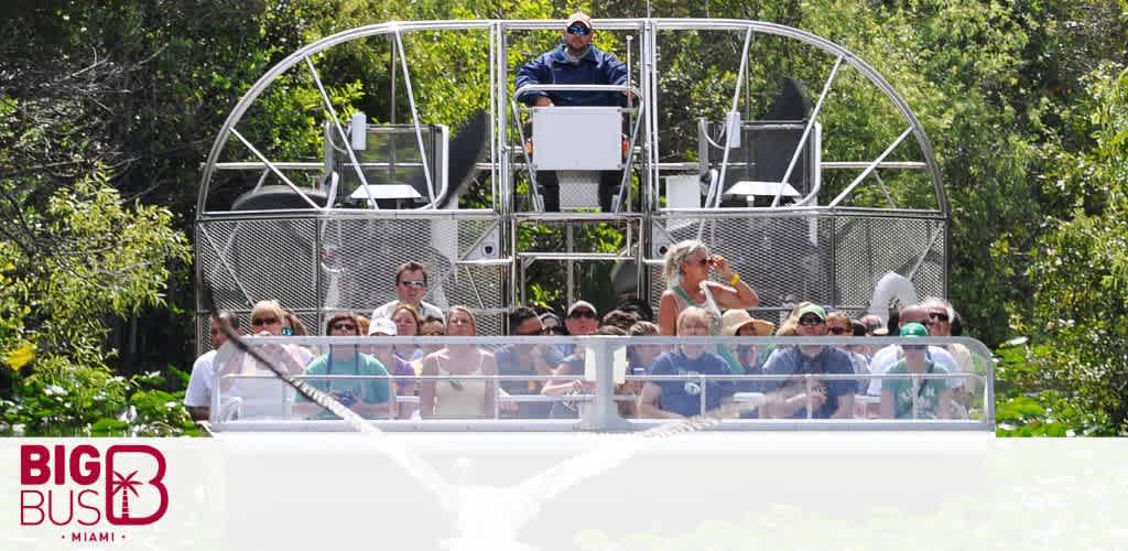 Tourists on an open-top Big Bus tour in Miami with a guide standing above them.