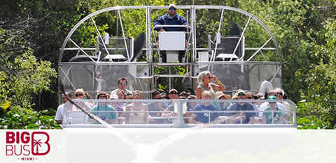 Tourists on a double-decker bus enjoying a sightseeing ride.