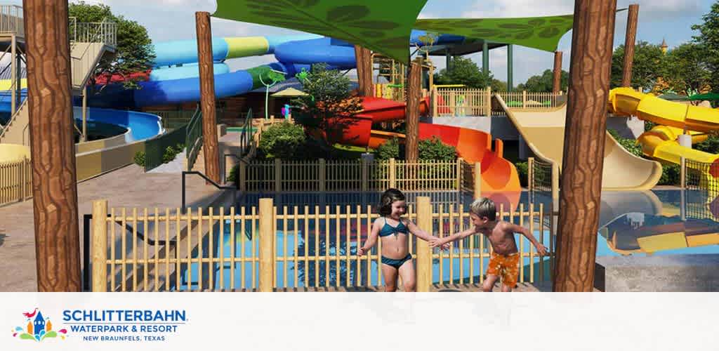 Image shows a sunny day at Schlitterbahn Waterpark with kids playing near a colorful array of water slides. One child in blue swimwear, another in orange patterned trunks, smile and hold hands by a fence. Trees and shaded areas offer respite from the sun.