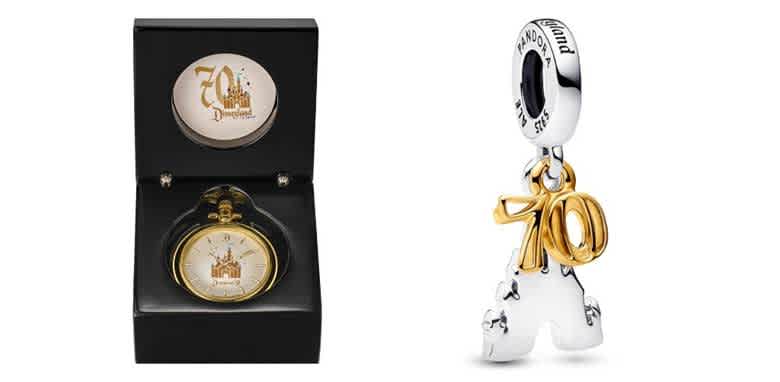 Black watch box featuring a classic pocket watch with a gold bezel and castle design on the face, commemorating a 70th anniversary. Next to it, a silver and gold charm with the number 70 and intricate detailing, designed to reflect a celebration theme. These items showcase elegant craftsmanship and make for memorable keepsakes.