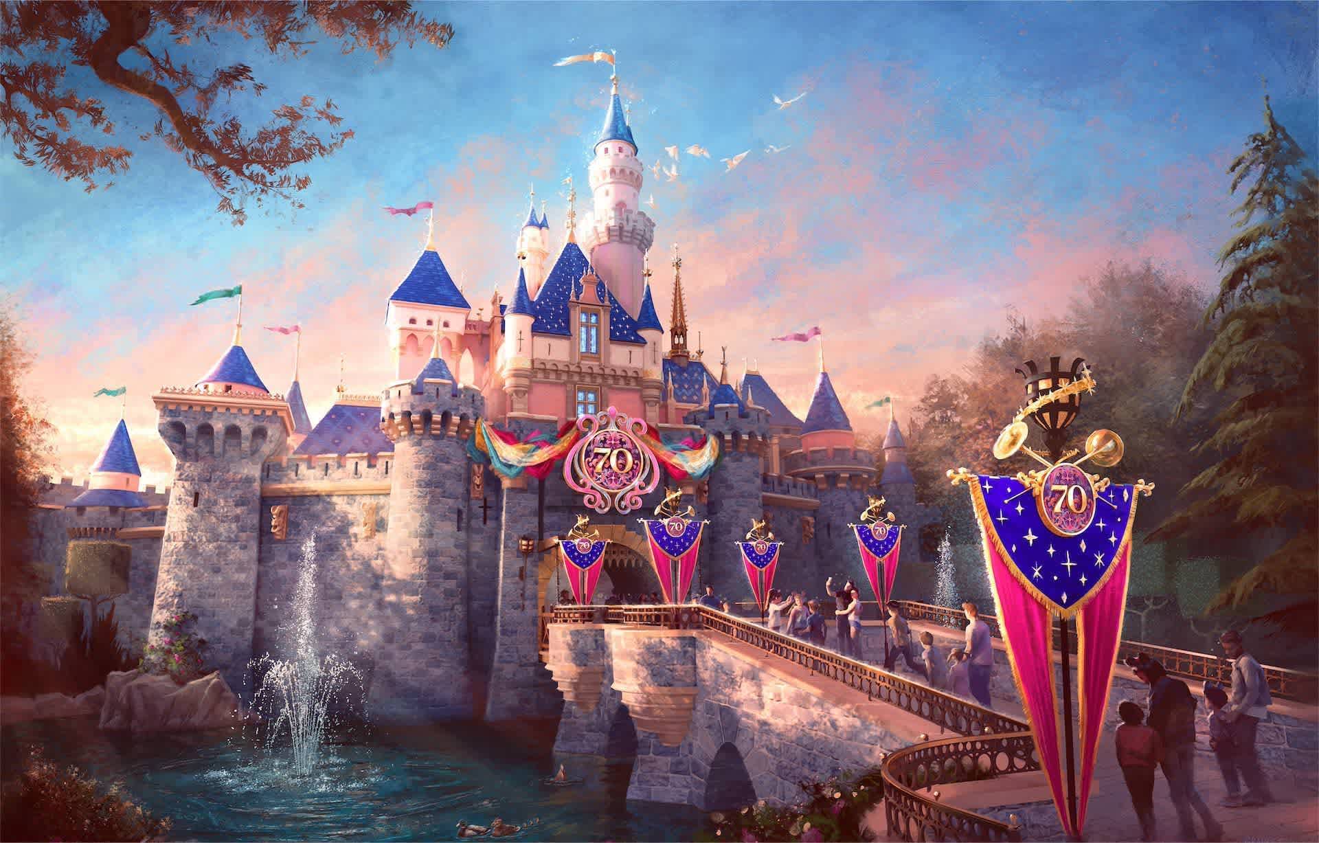 A colorful castle decorated for a 70th anniversary with banners and golden accents.