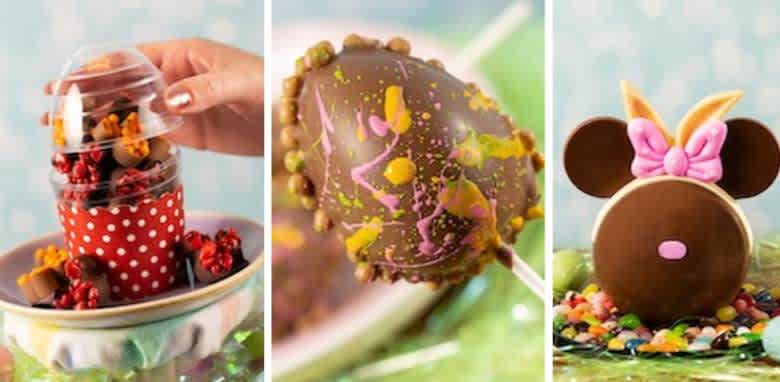 The image shows three colorful treats. The first is a clear cup filled with red and orange candies, enclosed in a red polka-dotted holder. The middle treat is a chocolate-covered egg-shaped dessert, decorated with colorful speckles on a stick. The last treat resembles a famous mouse character, made of chocolate with a pink bow and candy decorations around the base. The background is softly blurred with pastel tones.
