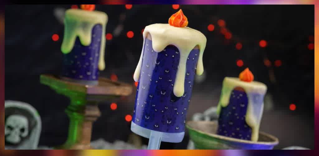 A spooky-themed image featuring three purple candles with white wax drips and small orange flames on top, set against a dim background. The candles are displayed on various stands amidst red glowing dots, creating an eerie ambiance. A skull decoration can be seen partially in the background on the left side, enhancing the Halloween atmosphere.