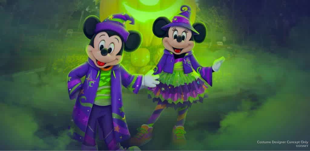 Two iconic cartoon mice stand together in a magical, foggy setting. They are dressed in vibrant purple and green attire, resembling fun Halloween costumes. The mouse on the left wears a purple hat and coat with star patterns, while the one on the right has a witch's hat and a layered skirt. A glowing crescent moon decorates the background, adding to the enchanting atmosphere.