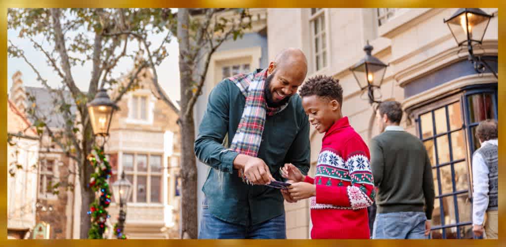 A joyful moment in a charming, decorated street scene with two people interacting happily. One wears a green shirt and scarf, the other a red festive sweater. Festive decorations and warm lighting enhance the cozy atmosphere, with additional individuals strolling in the background.