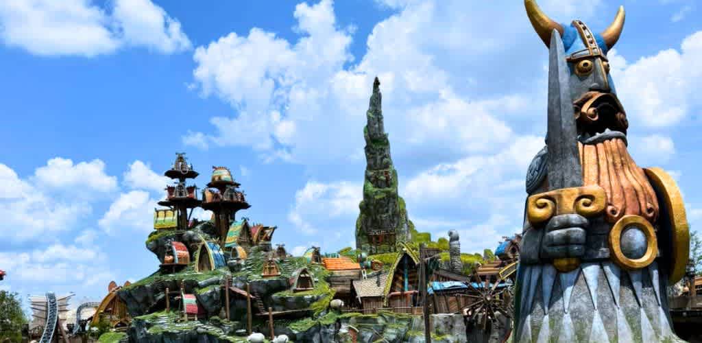 Colorful whimsical Viking themed sculpture with a blue sky and clouds in background at funex.com