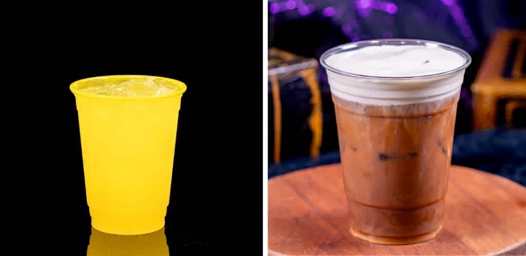 A yellow plastic cup with a cold beverage and a clear plastic cup with a layered cold drink on a wooden surface.