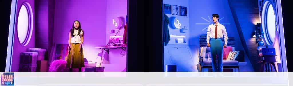 Description of two people facing holographic virtual reality environments with vibrant lighting and modern decor.