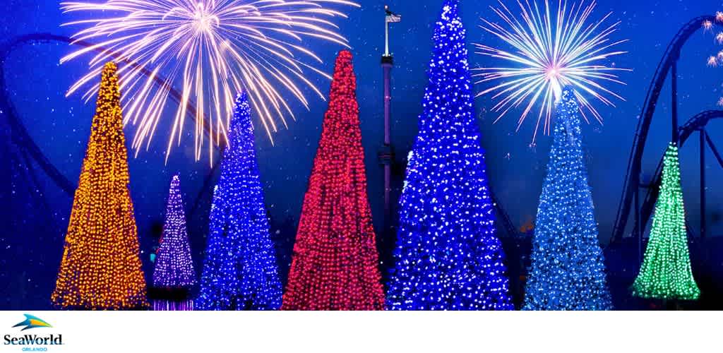 Illuminated Christmas trees with multicolored lights and fireworks at night.