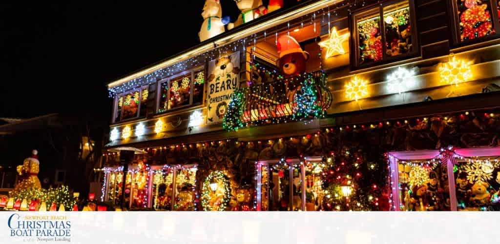 A decorated house with colorful Christmas lights, ornaments, and holiday figurines displayed inside and outside during nighttime, creating a festive and cheerful holiday scene.