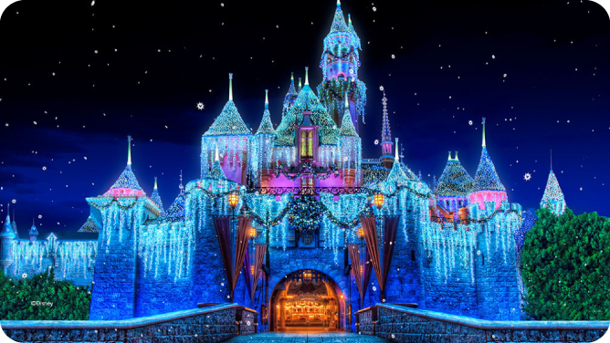 A brightly lit Disney castle illuminated with colorful lights against a starry night sky during a nighttime event