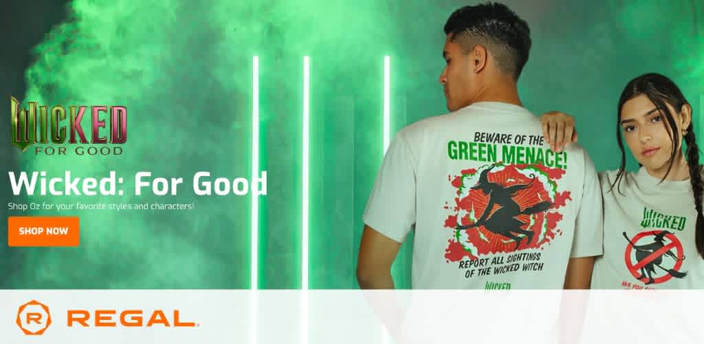 Two young adults wearing themed t-shirts in a green mist with glowing vertical lights, showcasing 