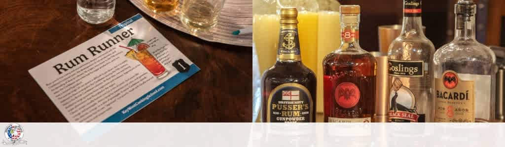 A drink menu titled Rum Runner next to bottles of Bacardi and Goslings liquor on a bar countertop