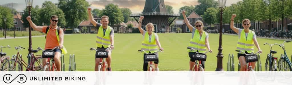 Five people wearing yellow safety vests are riding bikes outdoors on a sunny day in a park with green grass and trees.