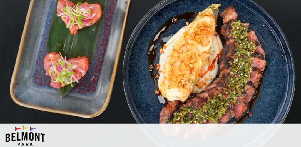 Two dishes on separate plates with a Belmont Park logo.