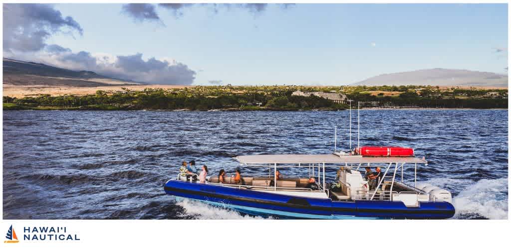 A boat cruising on a body of water with a distant shoreline and open sky in the background