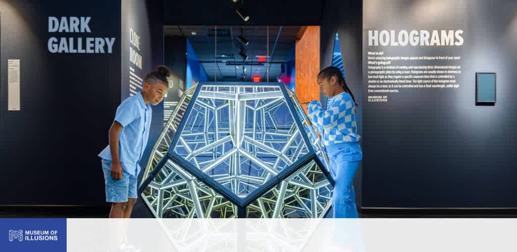 Young guests checking out a display at Museum of Illusions Seattle