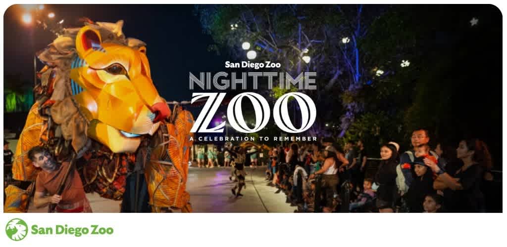 Crowd watching a nighttime zoo event with a large tiger lantern and colorful lighting at San Diego Zoo