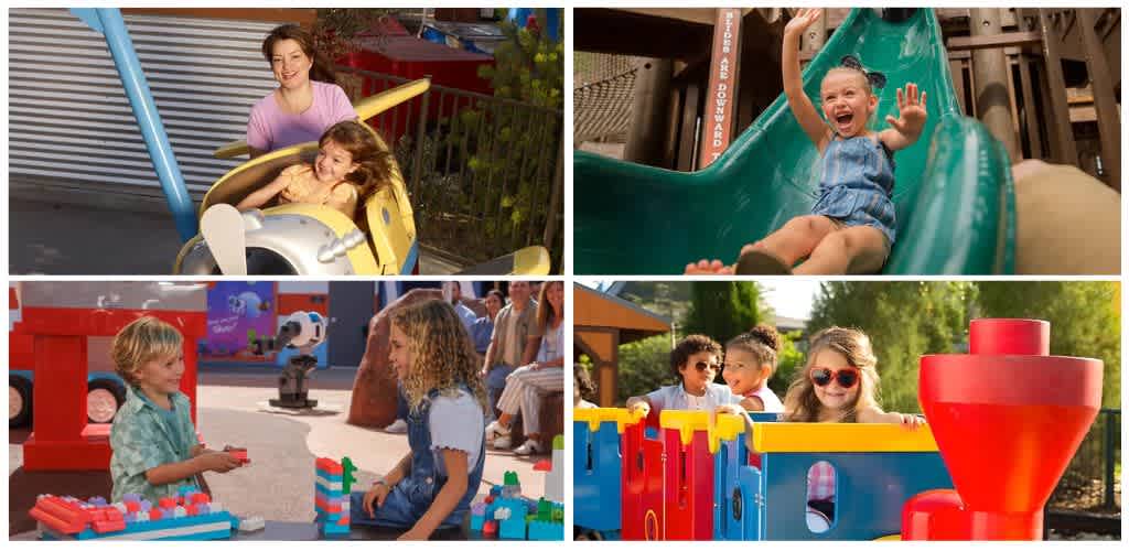 Children enjoying rides and play structures at an outdoor amusement park on a sunny day