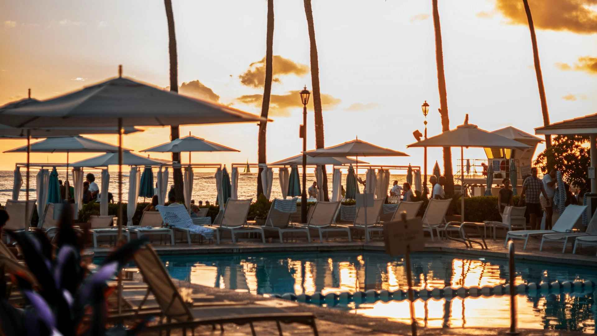 Sunset over resort loungers