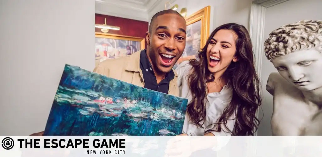 A joyful man and woman holding a blue-toned impressionist painting, celebrating a fun moment together. They are expressing excitement with wide smiles. In the background, a classical sculpture adds to the elegant interior. Below is the logo for THE ESCAPE GAME NEW YORK CITY.