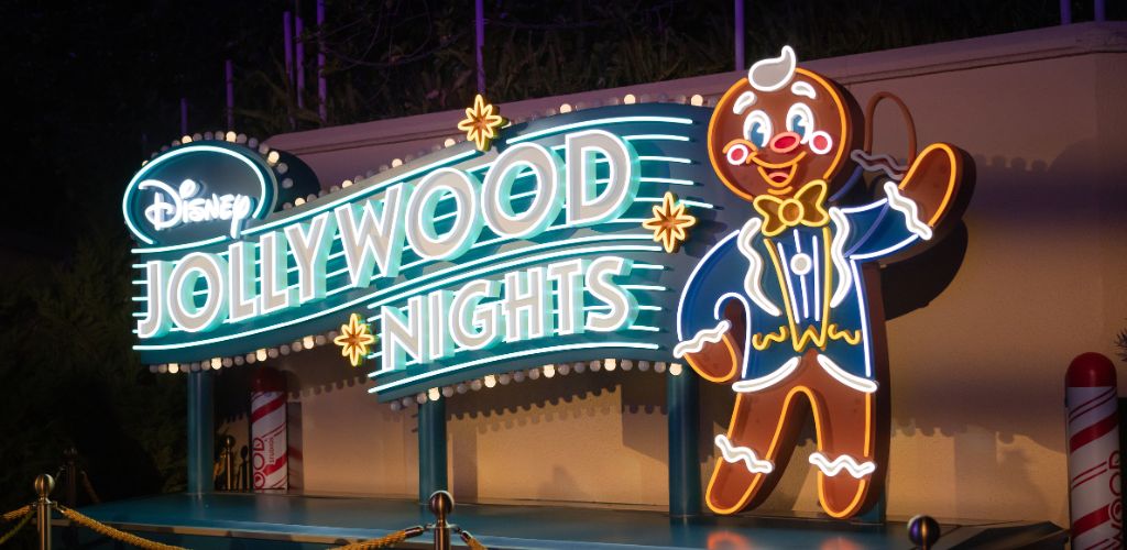 Disney Hollywood Nights event featuring vibrant lights, themed decorations, and guests enjoying the festive atmosphere.