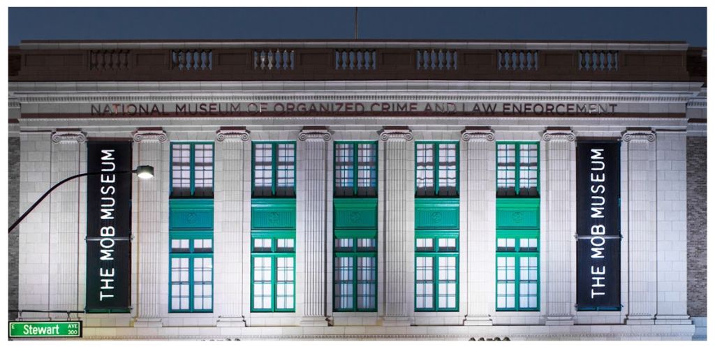 Facade of the National Museum of Organized Crime and Law Enforcement featuring vertical banners and classical architectural details