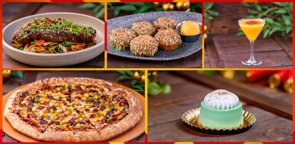 A variety of food and drinks includes a pizza, a salad, a layered dessert, and a cocktail on a wooden table with festive decorations in the background.